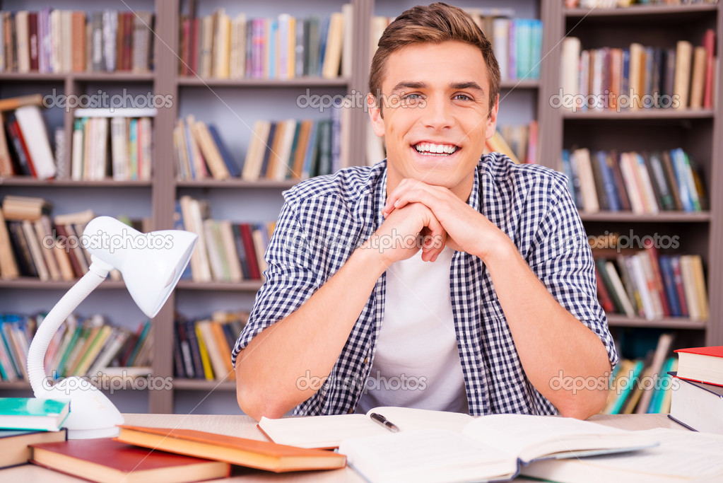 Handsome young man in library
