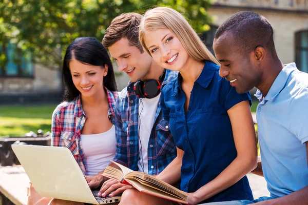 Four happy young students — Stock Photo, Image