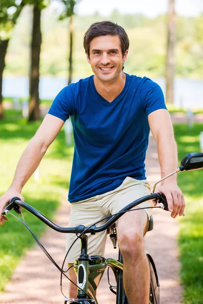 Man riding bicycle in park Royalty Free Stock Photos