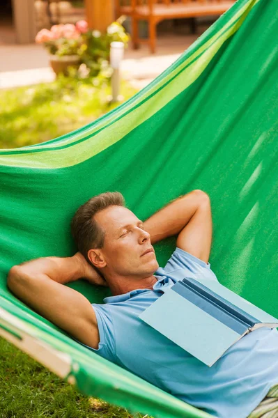 Mature man sleeping  in hammock Stock Photo