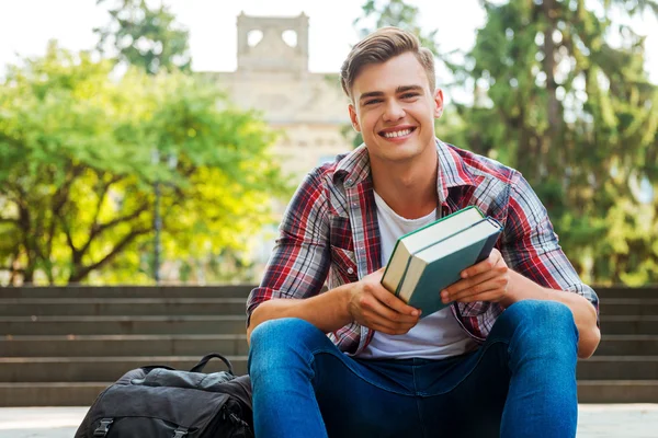 Student holding textbooks — Stock Photo, Image