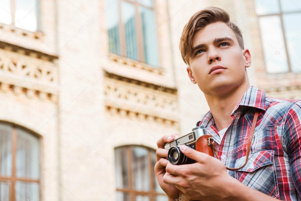 Man holding vintage camera