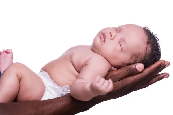 Black hands holding cute little baby — Stock Photo, Image