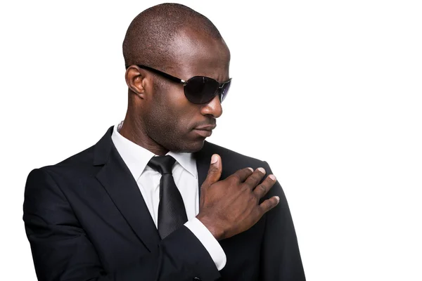 African man in formalwear adjusting his jacket — Stock Photo, Image