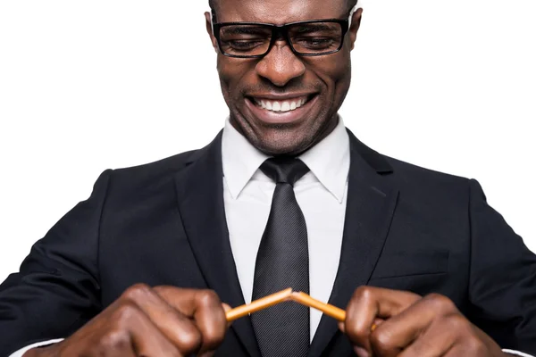 African man in formalwear breaking pencil — Stock Photo, Image