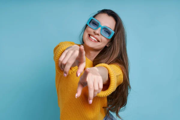 Happy Young Woman Pointing Camera Smiling While Standing Blue Background — Stock Photo, Image