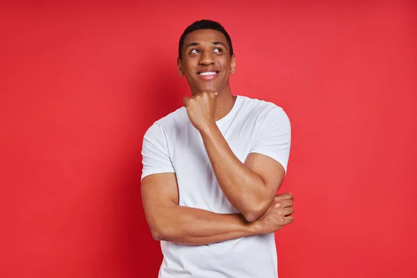 Cheerful Mixed Race Man Holding Hand Chin While Standing Red — Stock Photo, Image