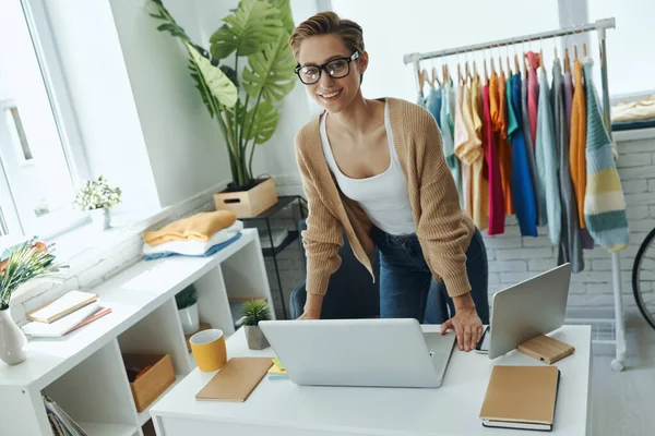 Cheerful Young Woman Looking Camera While Standing Fashion Store Office — Photo