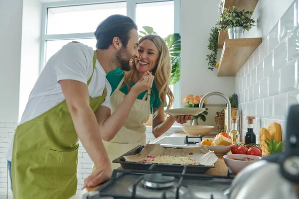 Playful Young Couple Making Homemade Pizza Kitchen Together — Foto Stock