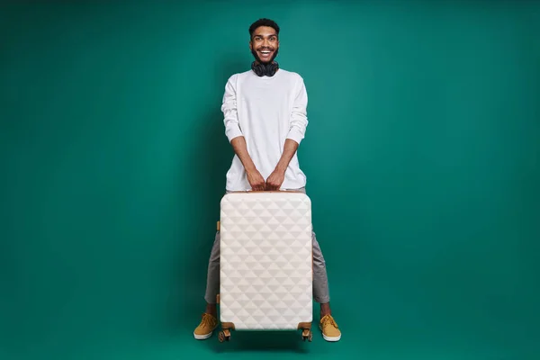 Full Length African Man Carrying Bag Smiling While Standing Green — ストック写真