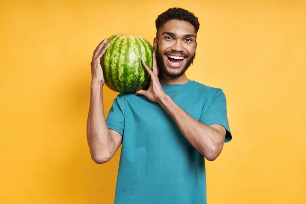 Happy African Man Carrying Watermelon Shoulder While Standing Yellow Background —  Fotos de Stock