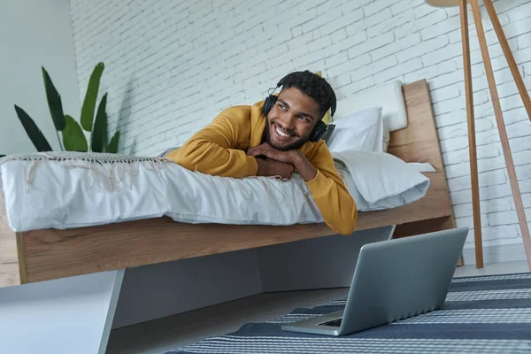 Dreamful African Man Headphones Relaxing Bed Home — Stockfoto