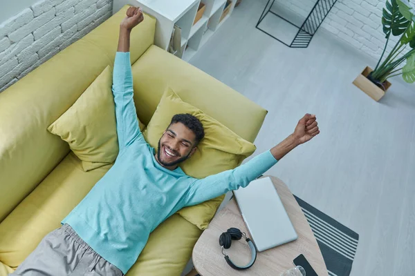 Top View Happy African Man Keeping Arms Outstretched While Relaxing — Foto Stock