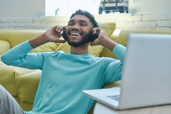 Joyful African Man Headphones Enjoying Music While Sitting Floor Home — Foto Stock