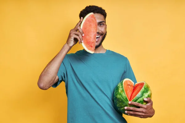 Playful African Man Holding Slice Watermelon Face While Standing Yellow — Photo