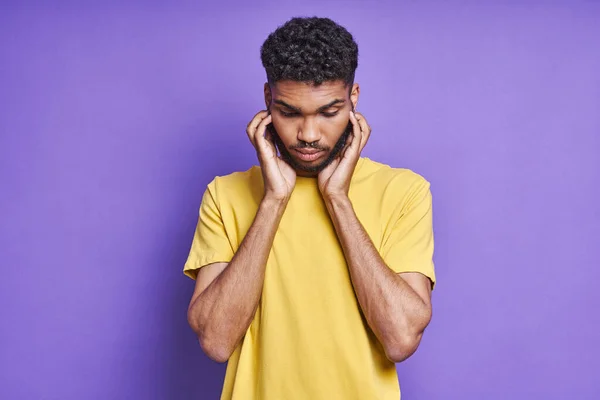 Frustrated African Man Touching Face While Standing Purple Background —  Fotos de Stock