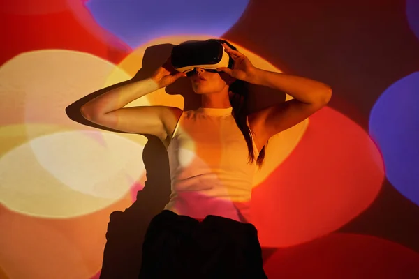 Confident Young Woman Adjusting Her Virtual Reality Glasses Colorful Background — 图库照片