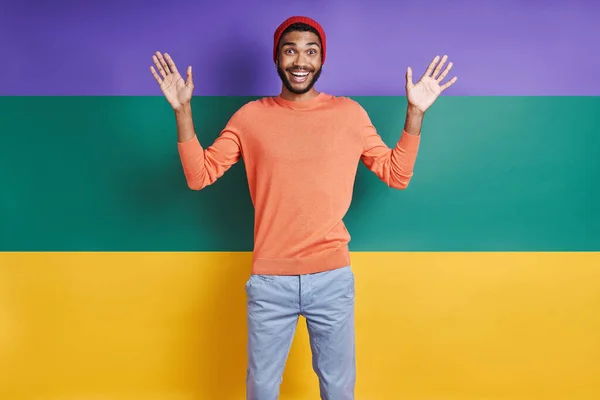 Surprised African Man Looking Camera Gesturing While Standing Colorful Background — ストック写真