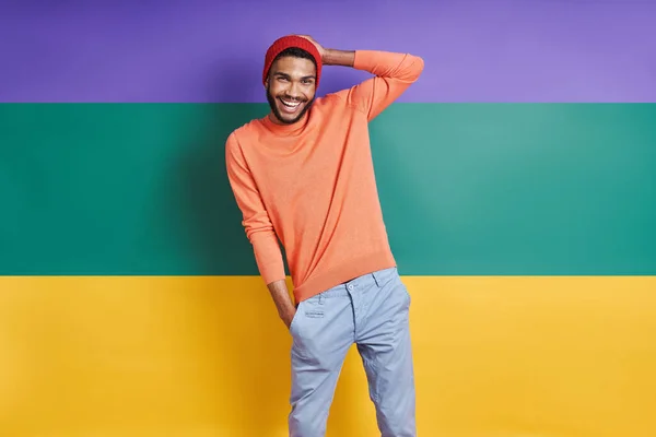 Cheerful African Man Looking Camera While Standing Colorful Background —  Fotos de Stock