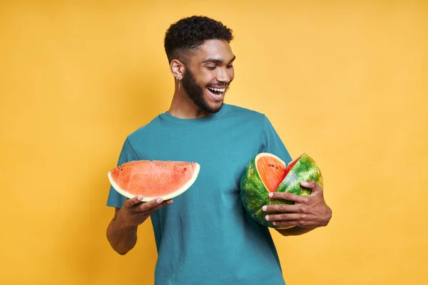 Handsome African Man Holding Watermelon Smiling While Standing Yellow Background — Stock Photo, Image