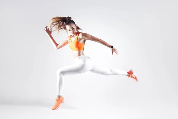 Beautiful Young Woman Sports Clothing Running White Background — Foto de Stock