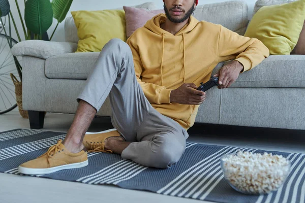 Close Young African Man Playing Video Games While Sitting Floor — Stockfoto