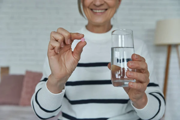 Close Happy Senior Woman Holding Pill Glass Water While Sitting — Fotografia de Stock