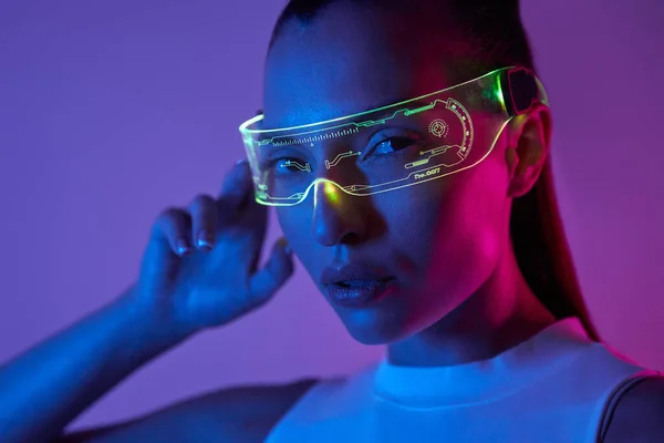 Beautiful Young Woman Adjusting Futuristic Glasses Dark Background — 图库照片