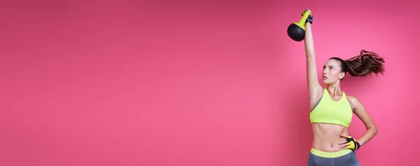 Beautiful Young Woman Sports Clothing Exercising Kettlebell Pink Background — Zdjęcie stockowe
