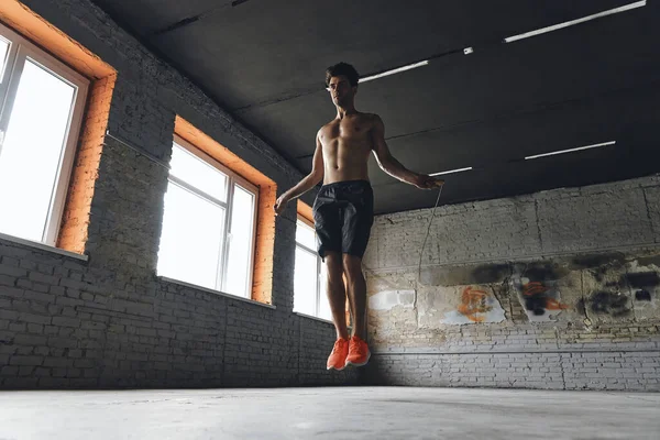 Full Length Confident Young Man Jumping Rope Gym — Foto de Stock