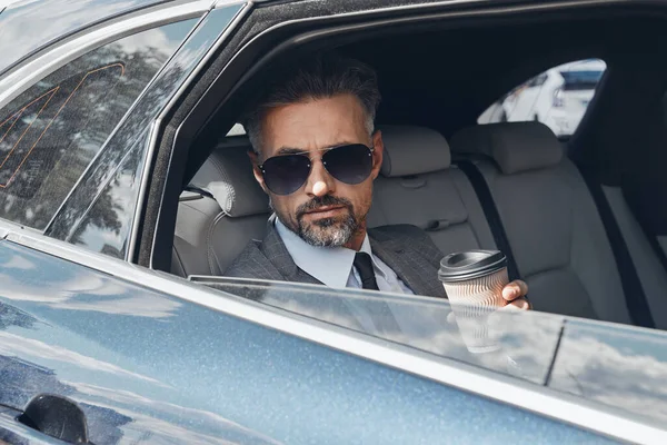 Mature Businessman Enjoying Coffee Looking Window While Sitting Car — Photo