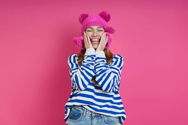 Playful Young Woman Pink Hat Touching Face Smiling While Standing — Stock Photo, Image