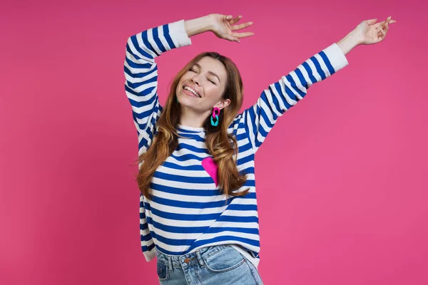 Happy Young Woman Keeping Arms Outstretched While Standing Colored Background — Foto Stock