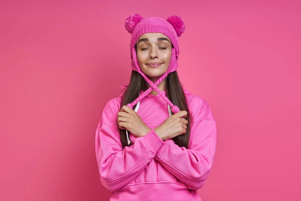 Playful Young Woman Hooded Shirt Adjusting Her Funky Hat Pink — Stock Photo, Image