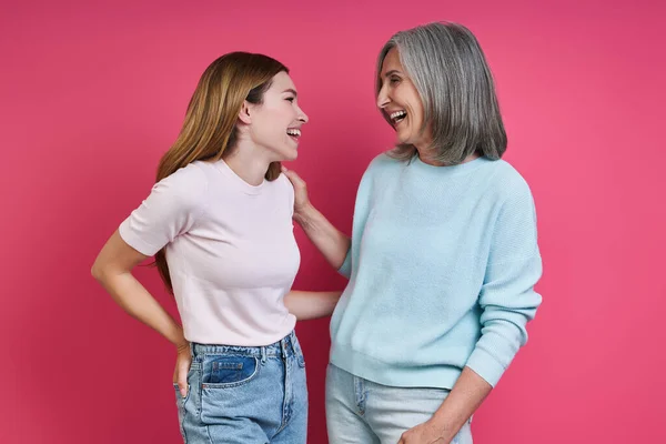 Happy Mother Adult Daughter Looking Each Other Pink Background — Photo