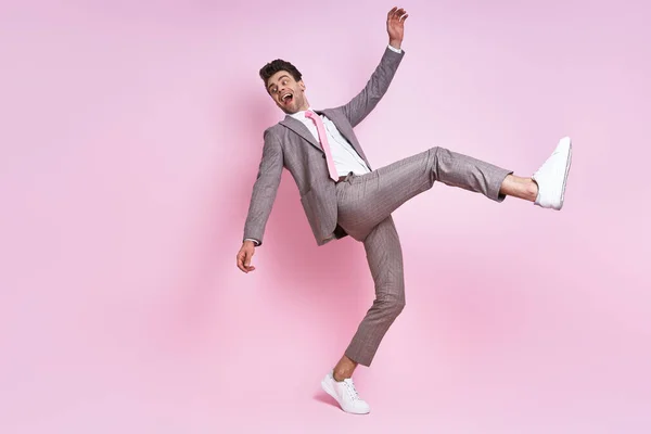Excited Young Man Full Suit Moving Pink Background — Foto Stock