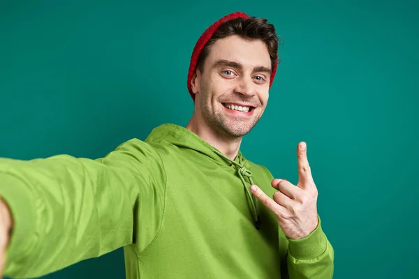 Cheerful Young Man Making Selfie Gesturing While Standing Green Background — Fotografia de Stock