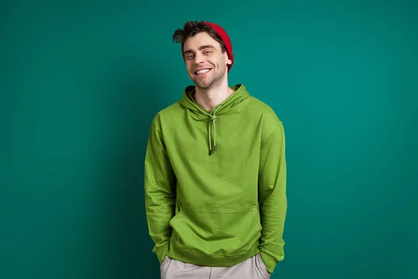 Confident Young Man Looking Camera Smiling While Standing Green Background — Stock fotografie