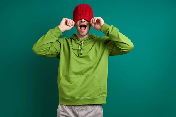 Playful Young Man Pulling His Hat Face Smiling While Standing — Photo