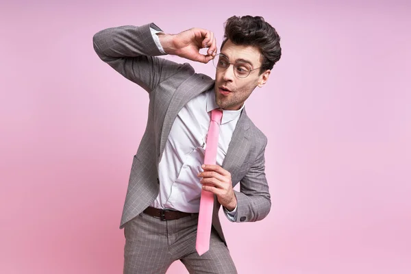 Surprised Man Full Suit Adjusting His Eyeglasses While Standing Pink — Foto Stock
