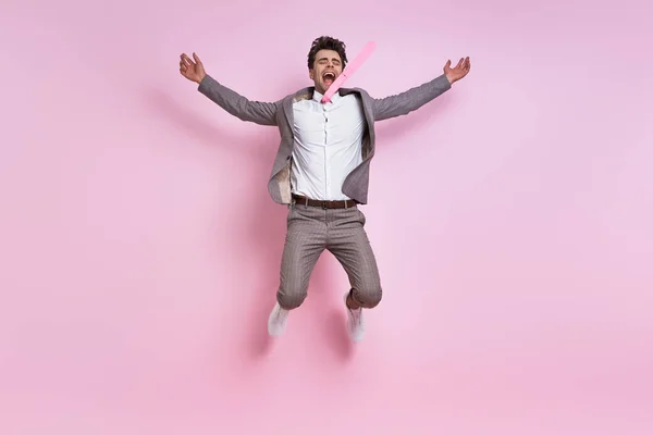 Excited Young Man Full Suit Jumping Pink Background — Stok fotoğraf