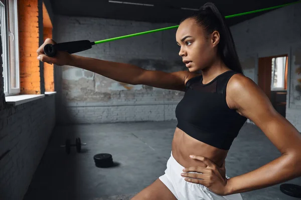 Confident Young Woman Exercising Elastic Resistance Band Gym — Foto de Stock