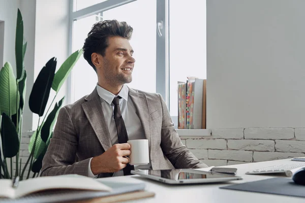 Handsome Man Holding Coffee Cup Smiling While Sitting His Working — Stock fotografie