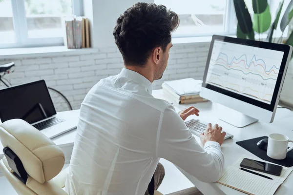 Rear View Man Using Computer While Sitting His Working Place — Stockfoto