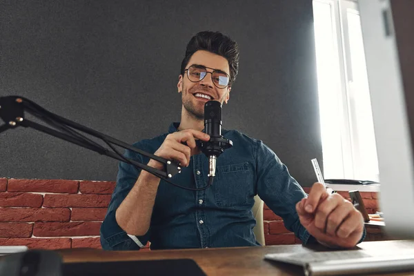Handsome Young Man Using Microphone Smiling While Recording Podcast Studio — Stock fotografie