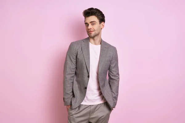 Handsome Young Man Suit Holding Hands Pockets While Standing Pink — Stockfoto