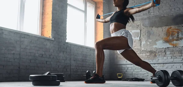 Unrecognizable Young Woman Using Elastic Resistance Band While Exercising Gym — Fotografie, imagine de stoc