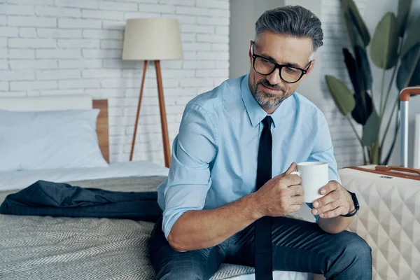 Handsome Man Shirt Tie Enjoying Coffee While Sitting Bed Luggage — Fotografia de Stock