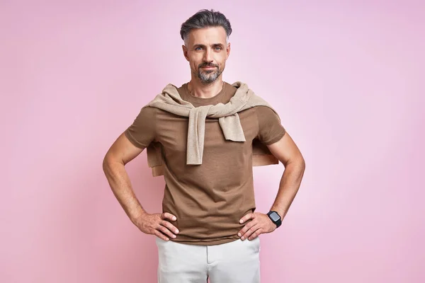 Fashionable Mature Man Holding Hands Hip While Standing Pink Background — Foto Stock