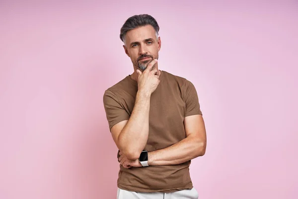 Handsome Mature Man Holding Hand Chin While Standing Pink Background — 스톡 사진